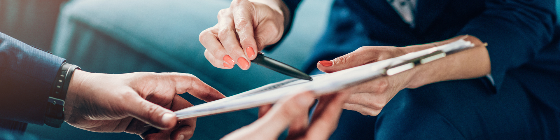 Two professionals review a contract