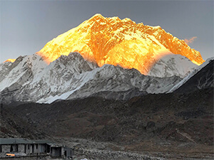 Mount Everest peak in golden sunlight
