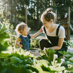 Mother with toddler daughter in the garden