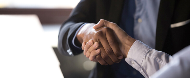 Business people shake hands