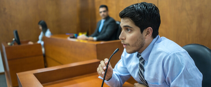 Person being interview on the witness stand in court